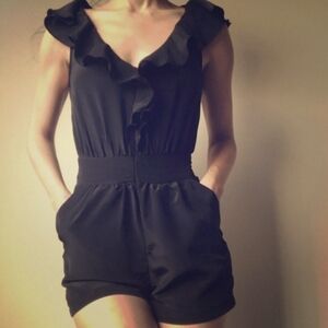Urban Outfitters Pins and Needles black romper shorts pockets ruffle neckline M